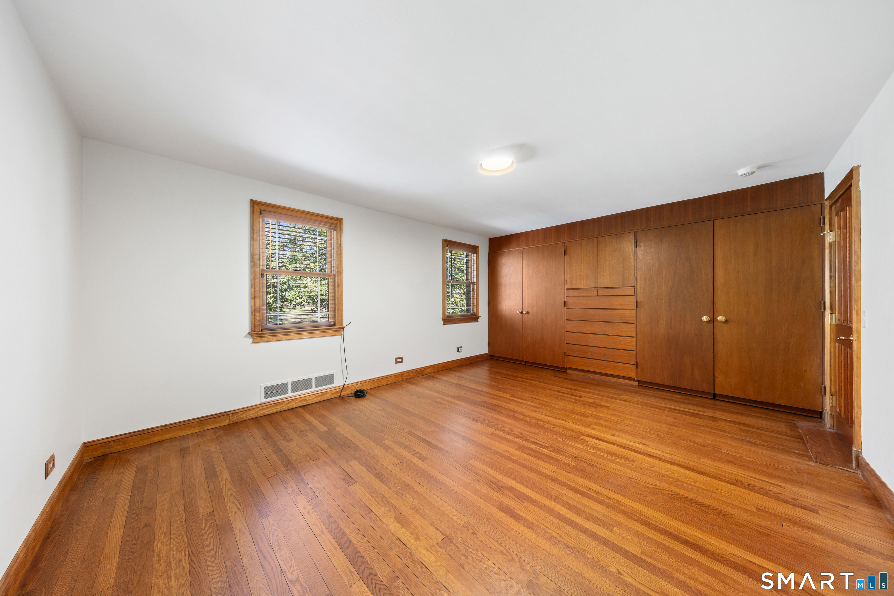 143 Palmer Hill Road Stamford, CT 06902 - Photo 25 of 40 an empty room with wooden floor and window