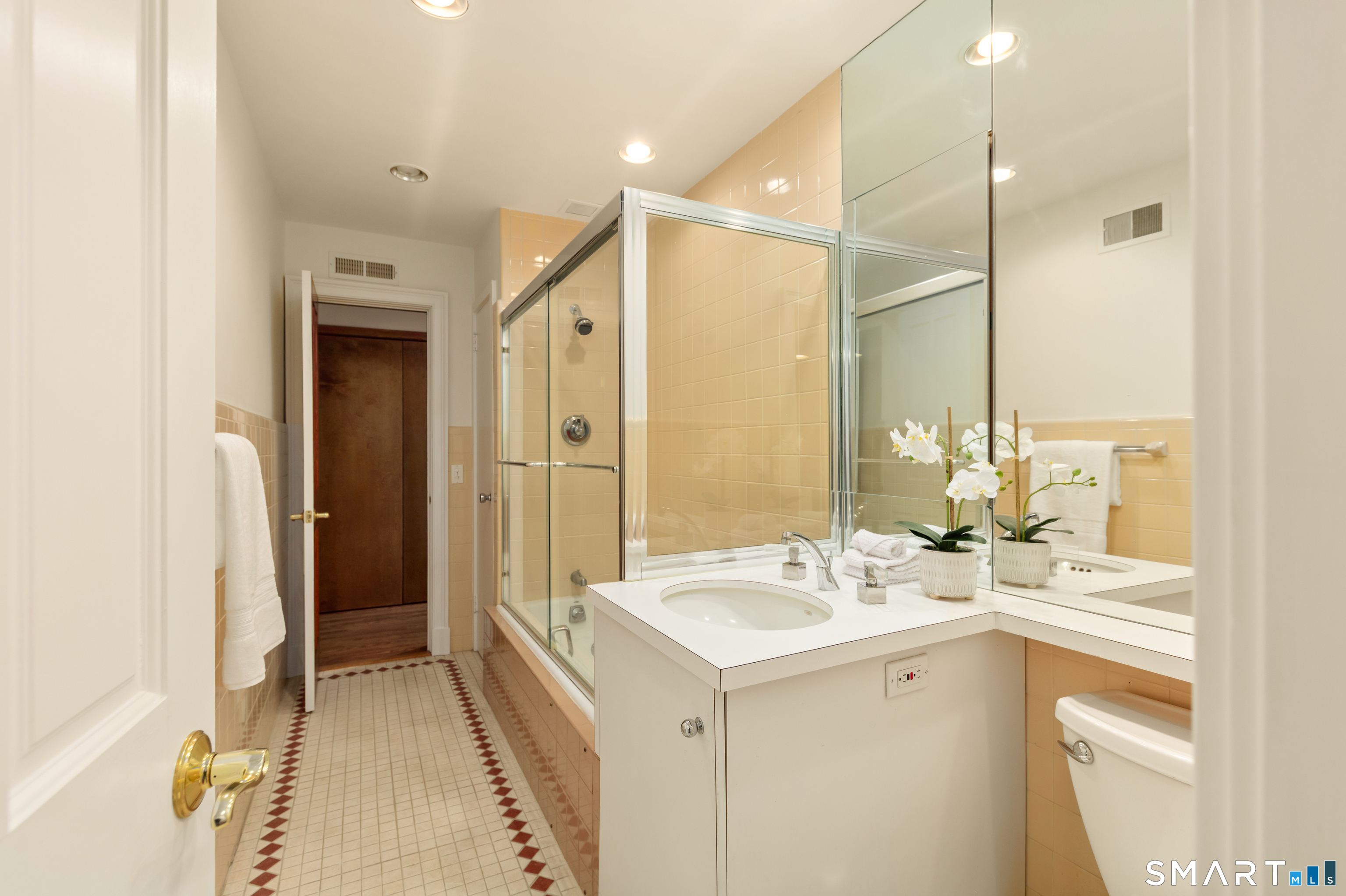 143 Palmer Hill Road Stamford, CT 06902 - Photo 26 of 40 a bathroom with a double vanity sink and a mirror