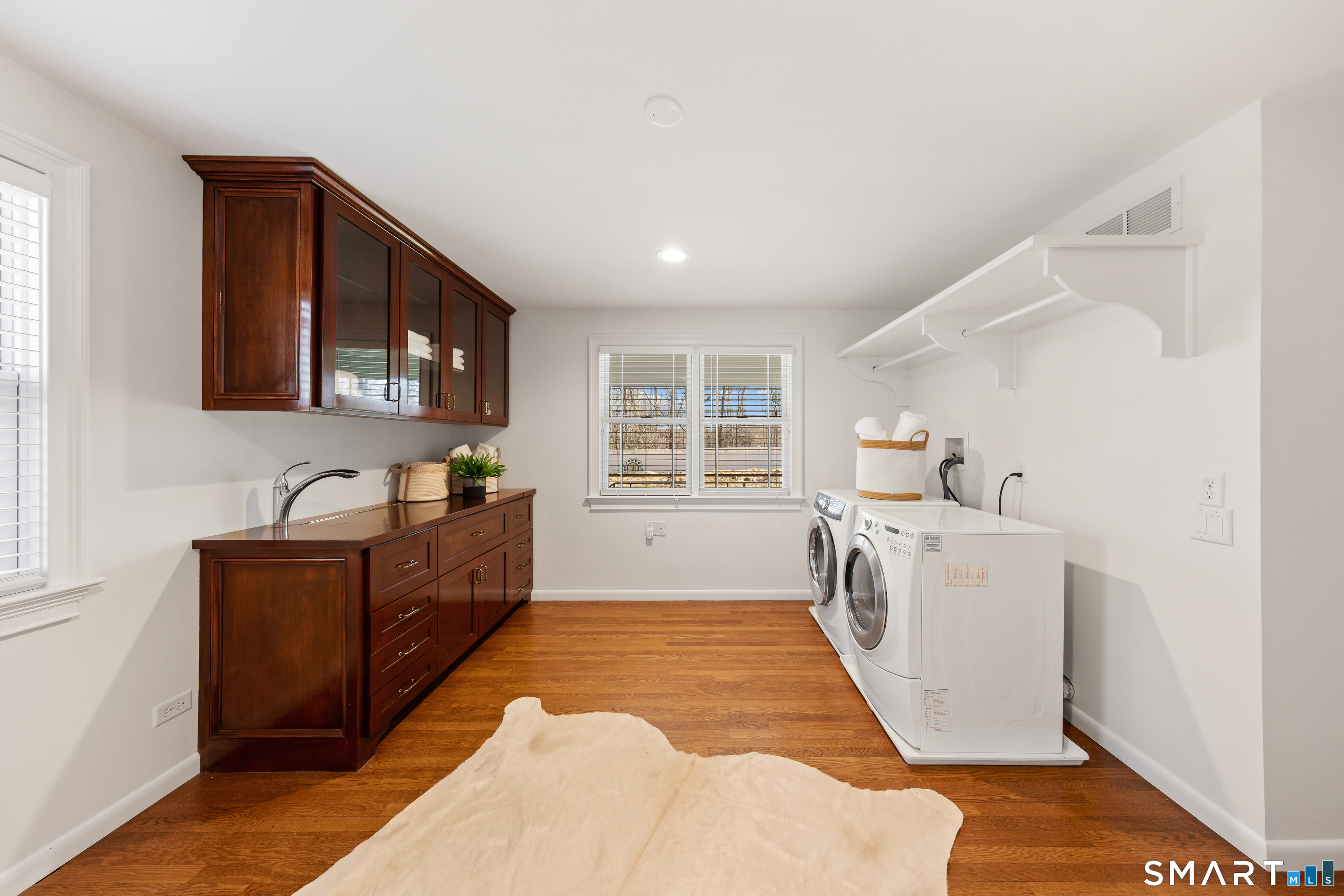 143 Palmer Hill Road Stamford, CT 06902 - Photo 28 of 40 a kitchen with sink cabinets and window
