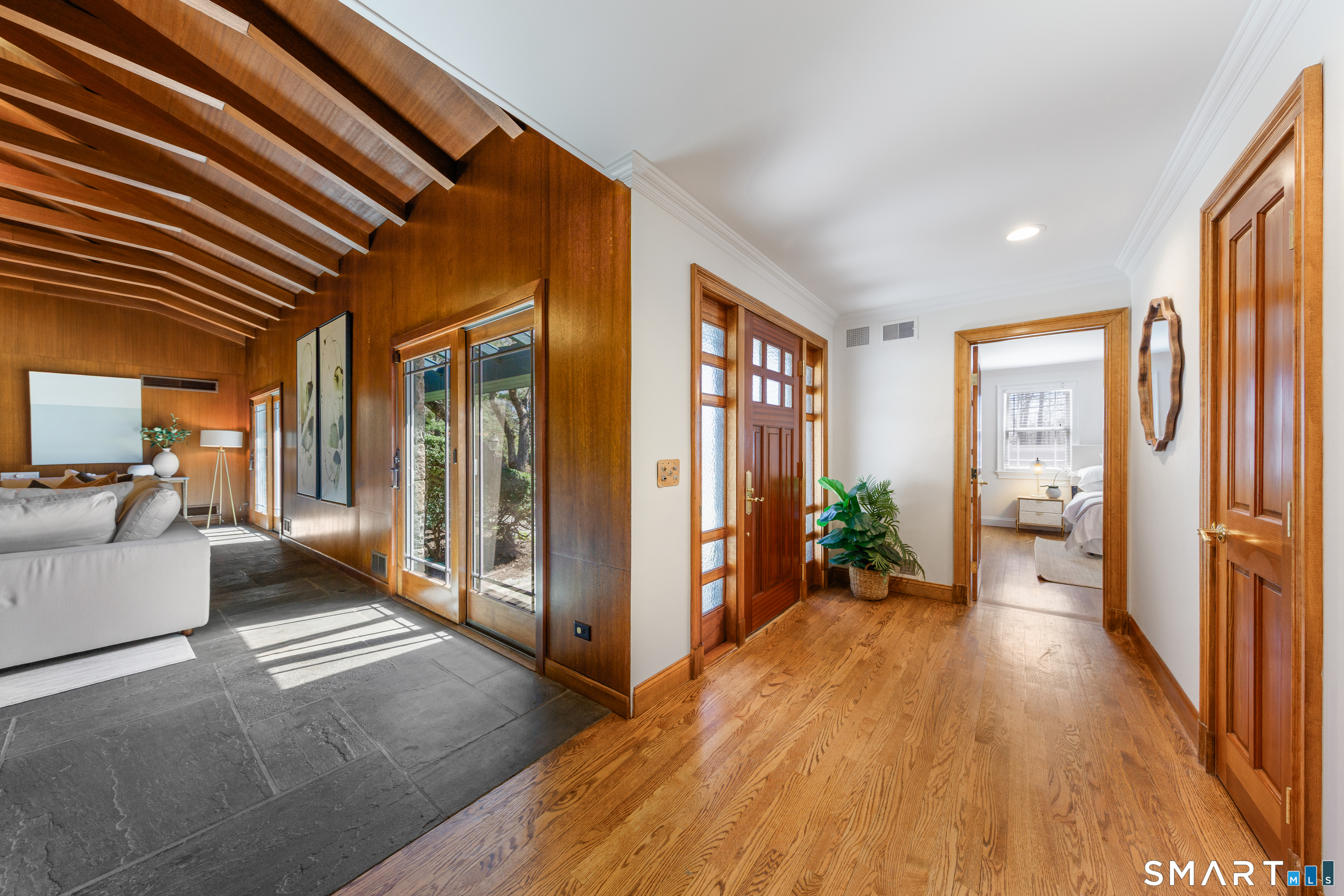 143 Palmer Hill Road Stamford, CT 06902 - Photo 4 of 40 a view of a hallway with wooden floor and furniture