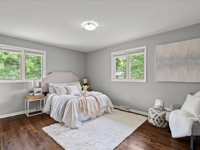 a bedroom with a bed and ceiling fan