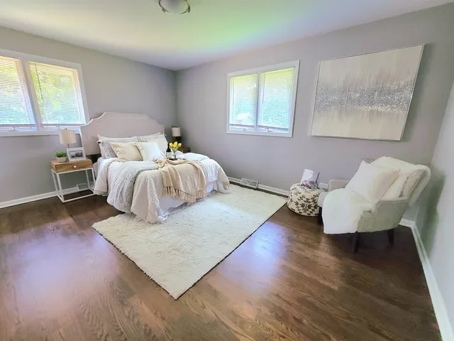 a bathroom with a sink toilet vanity and tub