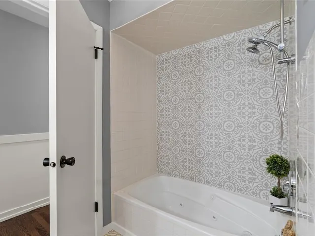 a living room with furniture a rug and white walls