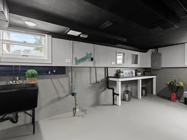 a big white house with a yard and sitting space