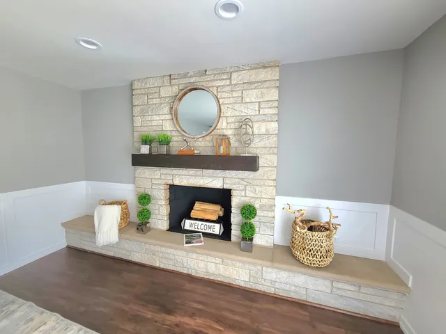 a living room with furniture and kitchen view