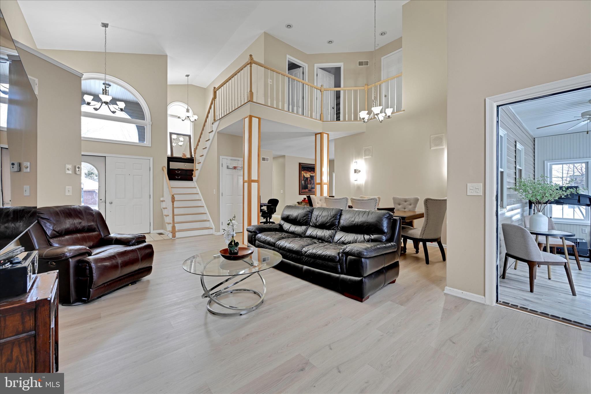 717 Brookside Lane Lebanon, PA 17042 - Photo 11 of 45 a living room with furniture and a chandelier