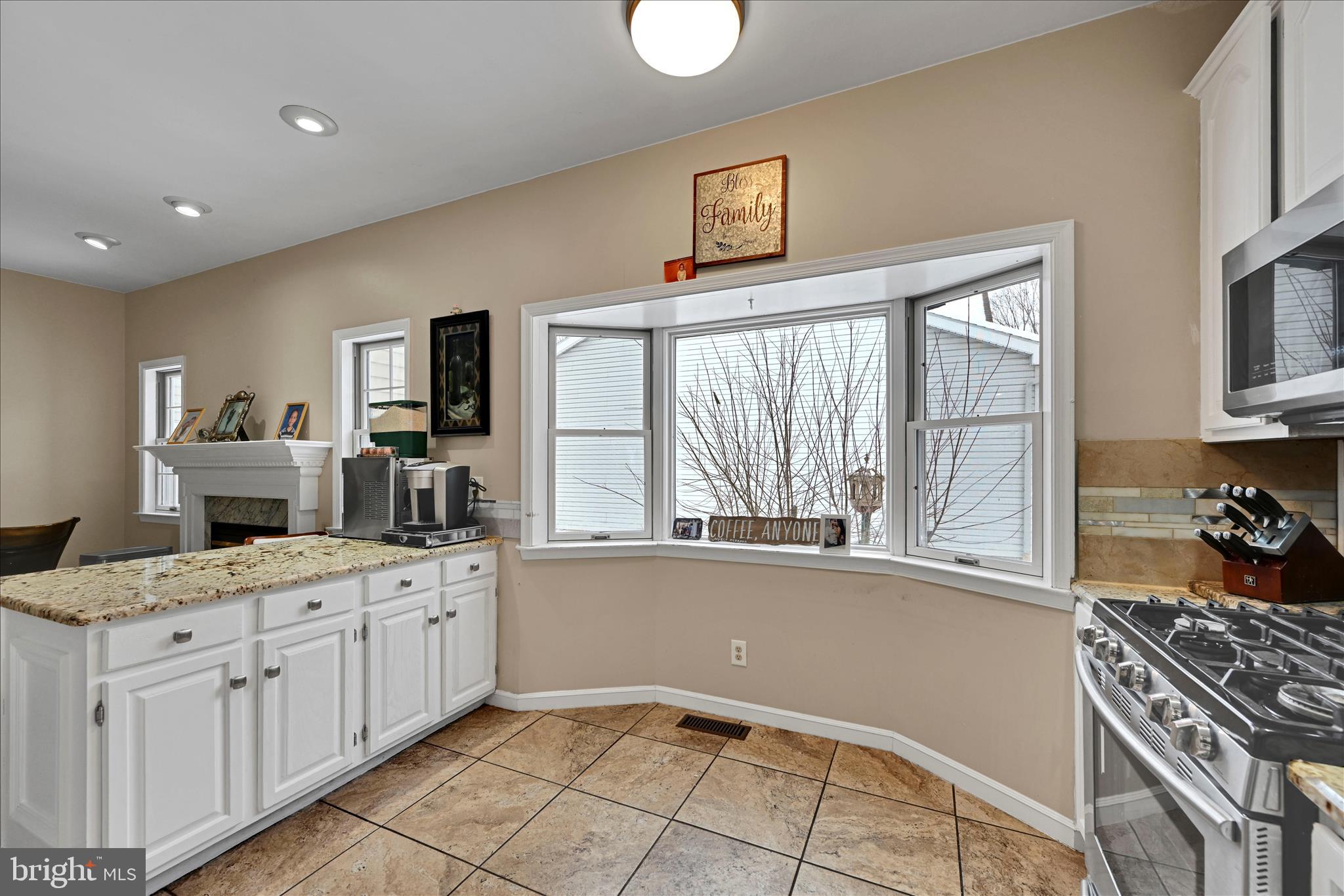 717 Brookside Lane Lebanon, PA 17042 - Photo 14 of 45 a kitchen with a stove a sink and a refrigerator