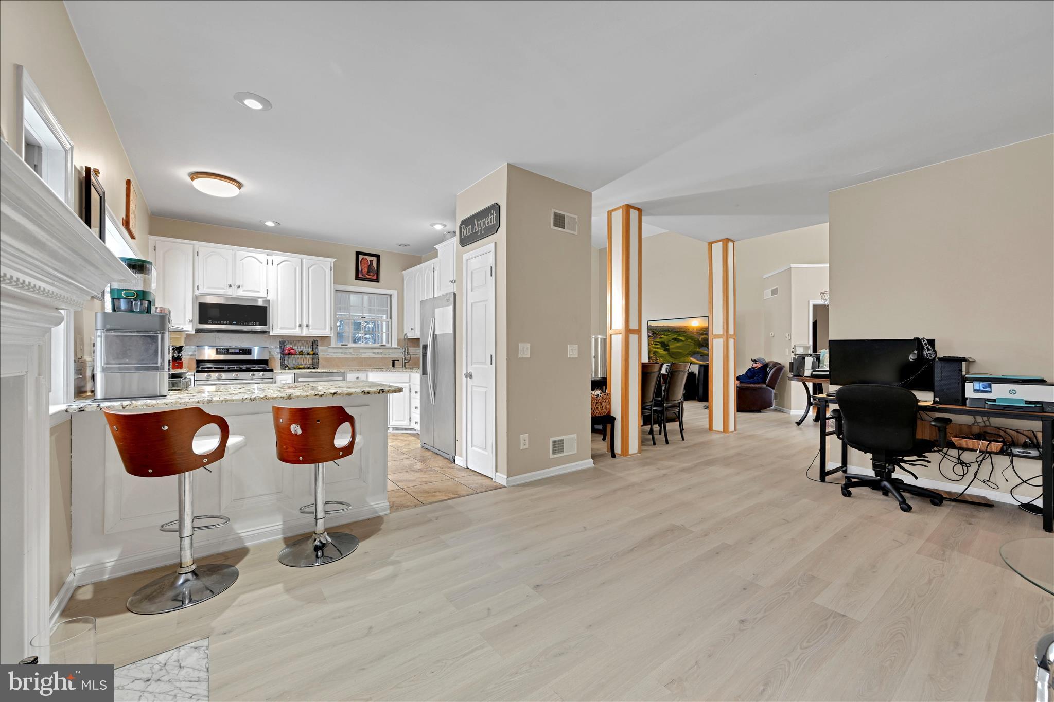 717 Brookside Lane Lebanon, PA 17042 - Photo 18 of 45 a view of kitchen with stainless steel appliances kitchen island granite countertop a refrigerator a stove a sink dishwasher and white cabinets with wooden floor