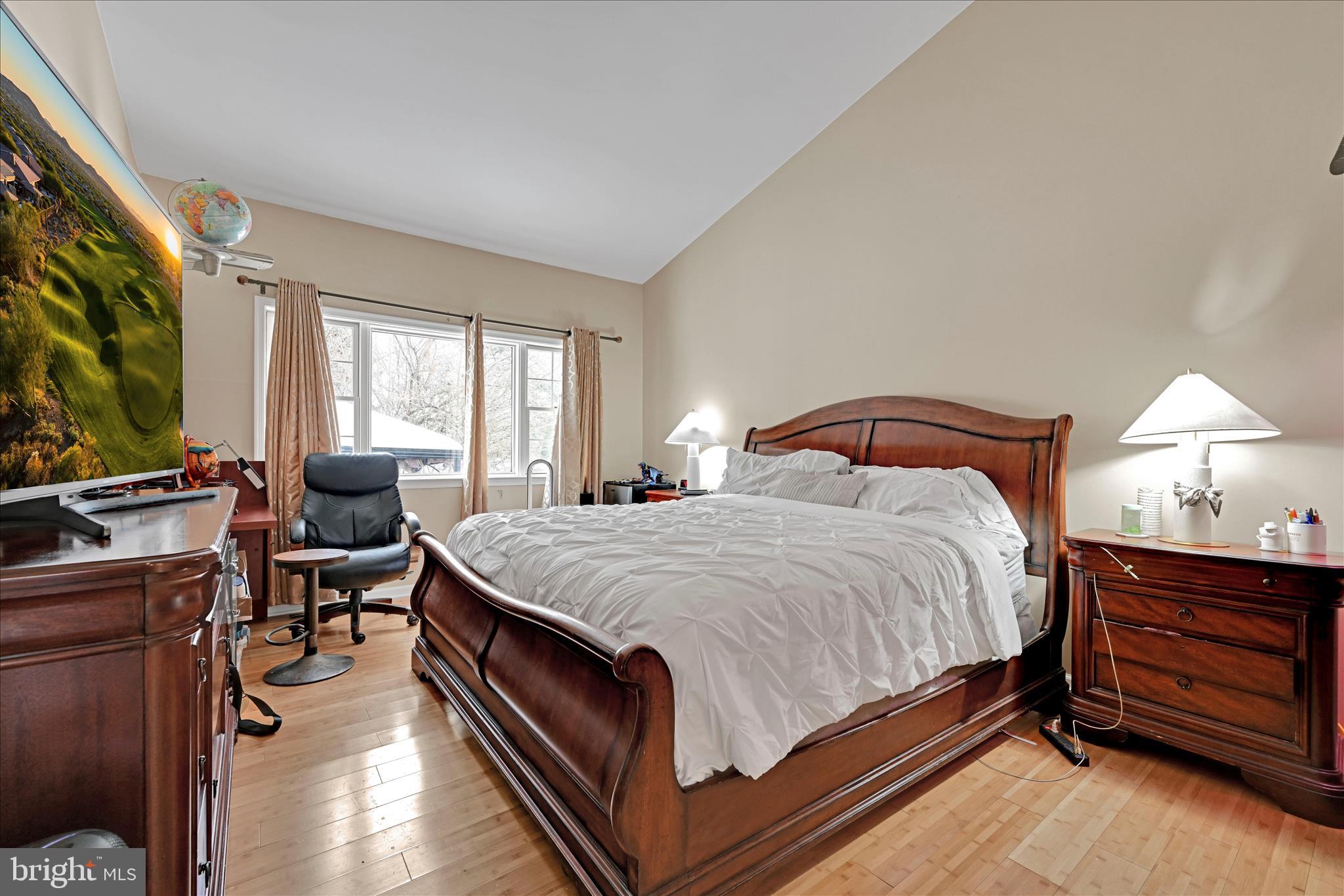 717 Brookside Lane Lebanon, PA 17042 - Photo 24 of 45 a bedroom with a bed and wooden floor