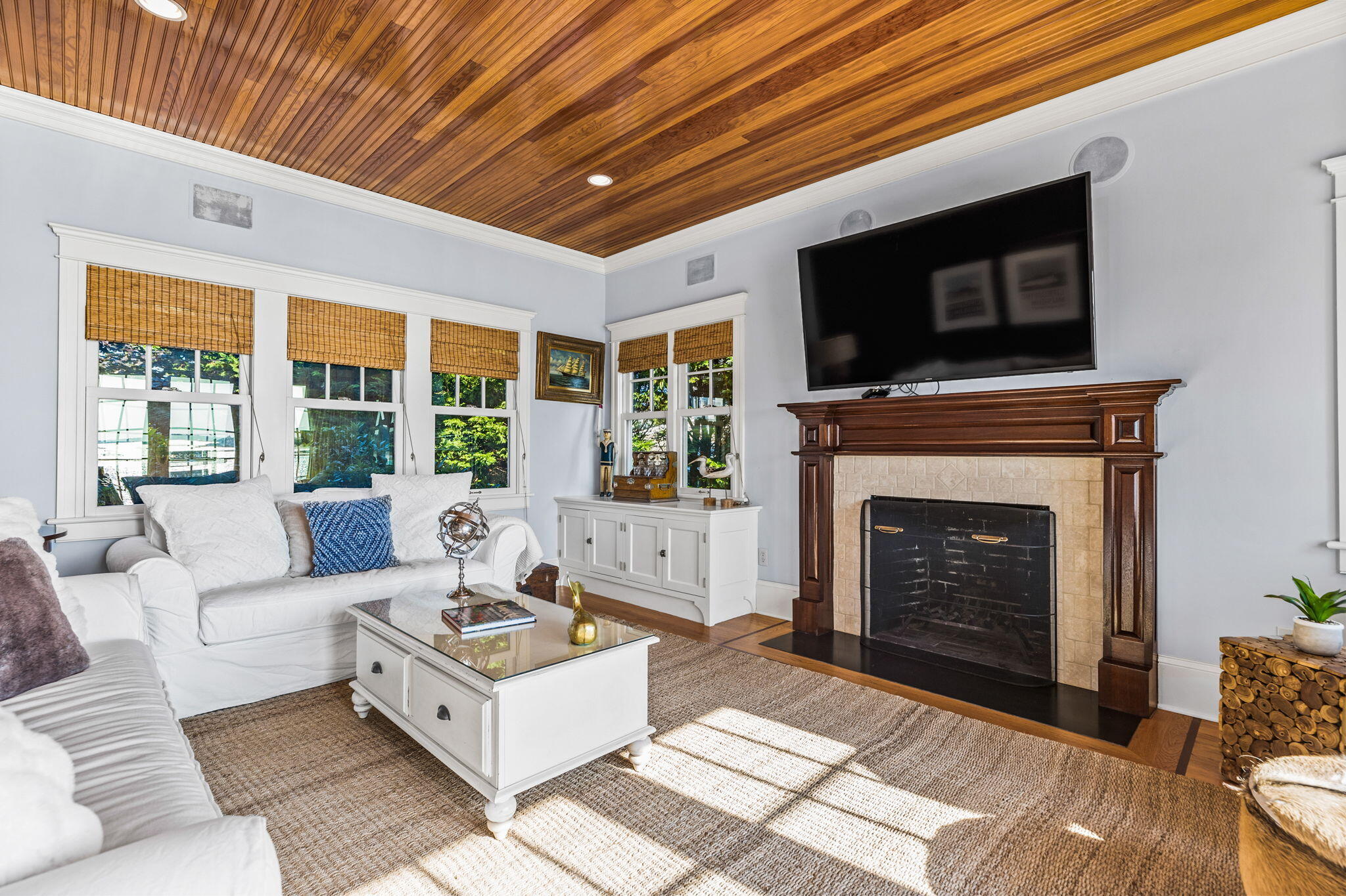 20 Bay Shore Road Hyannis, MA 02601 - Photo 17 of 42 a living room with furniture a flat screen tv and a fireplace