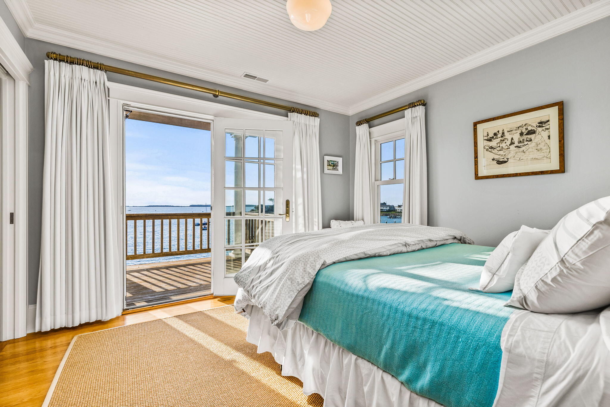 20 Bay Shore Road Hyannis, MA 02601 - Photo 34 of 42 a bedroom with a balcony a bed and a window