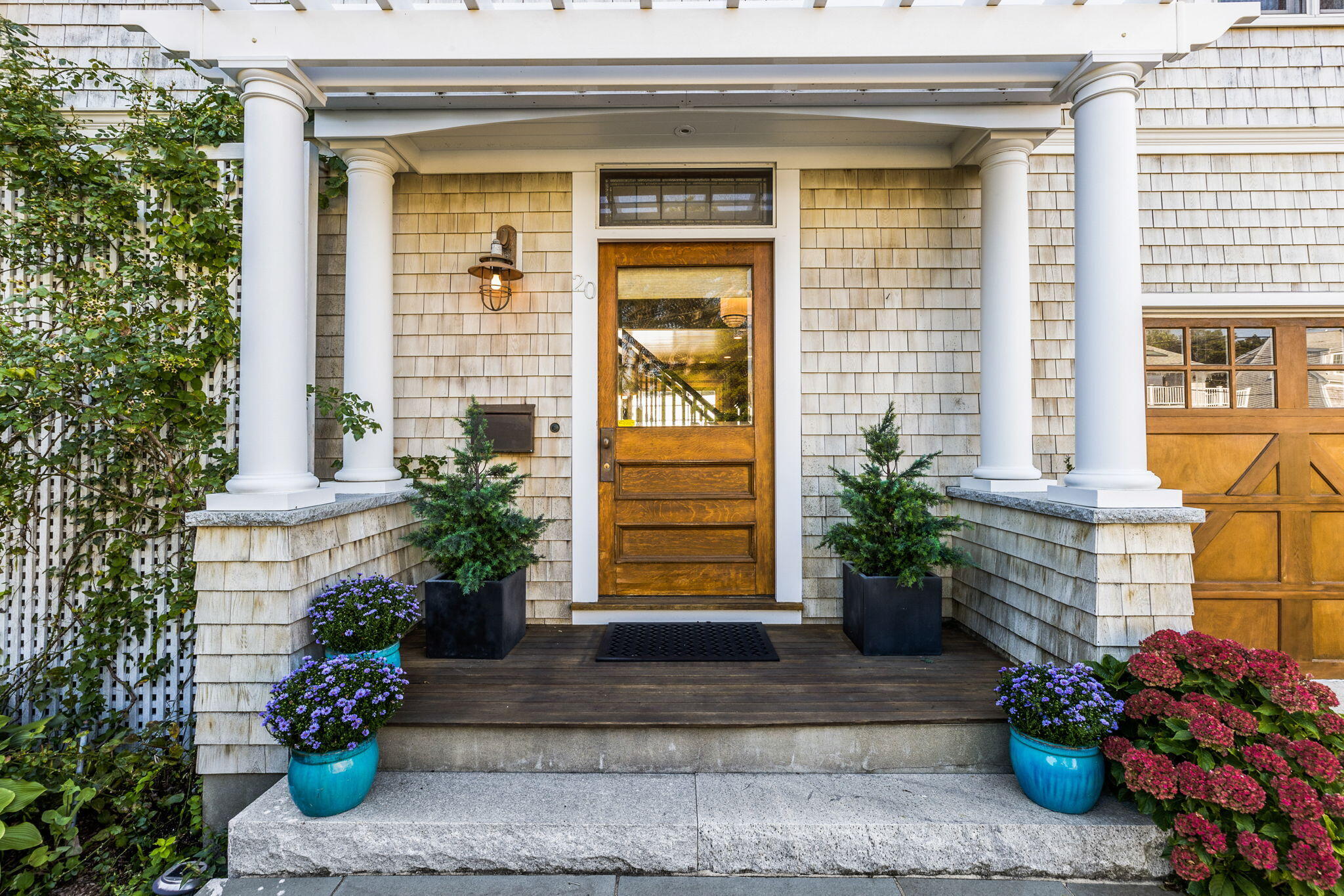 20 Bay Shore Road Hyannis, MA 02601 - Photo 7 of 42 a front view of a house with potted plants