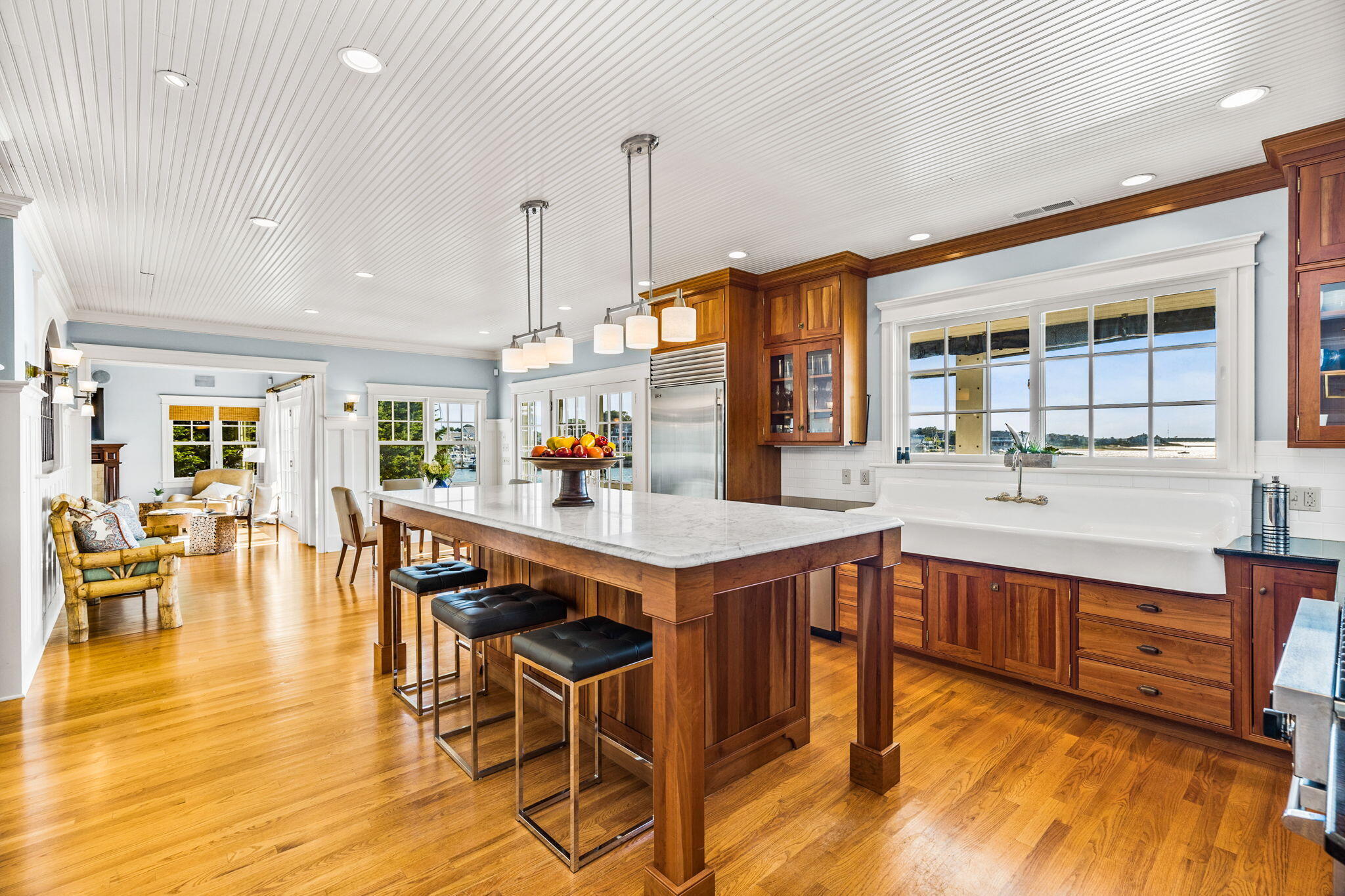 20 Bay Shore Road Hyannis, MA 02601 - Photo 10 of 42 a kitchen with stainless steel appliances granite countertop a table chairs and a wooden floor