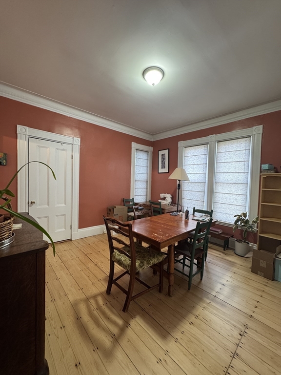 5 Spring Park Avenue, Unit 1 Boston, MA 02130 - Photo 6 of 24 a dining room with furniture window and wooden floor
