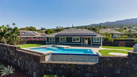 a view of a swimming pool and an outdoor seating