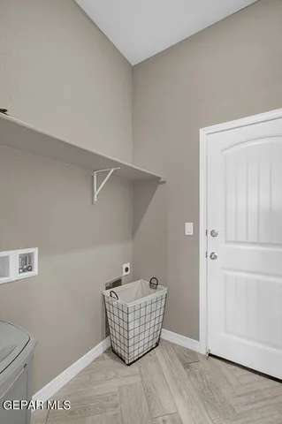 a view of a dining room with furniture wooden floor and chandelier