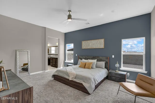 a bedroom with a bed and window