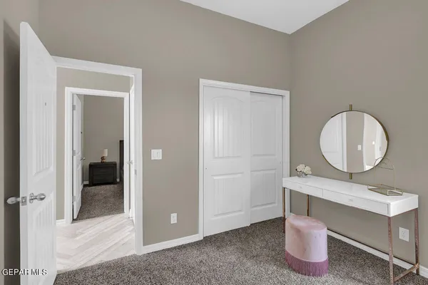 a bedroom with a bed and a lamp