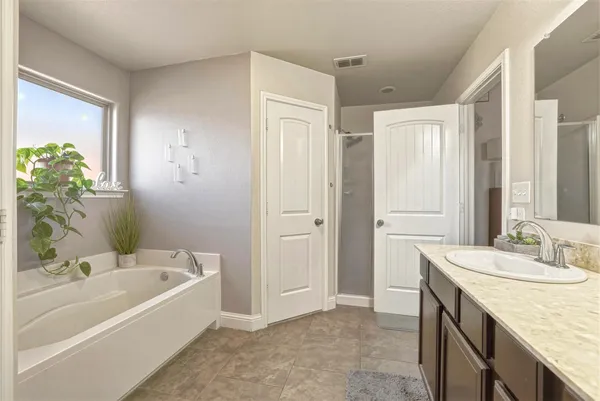 a white bath tub sitting in a bathroom