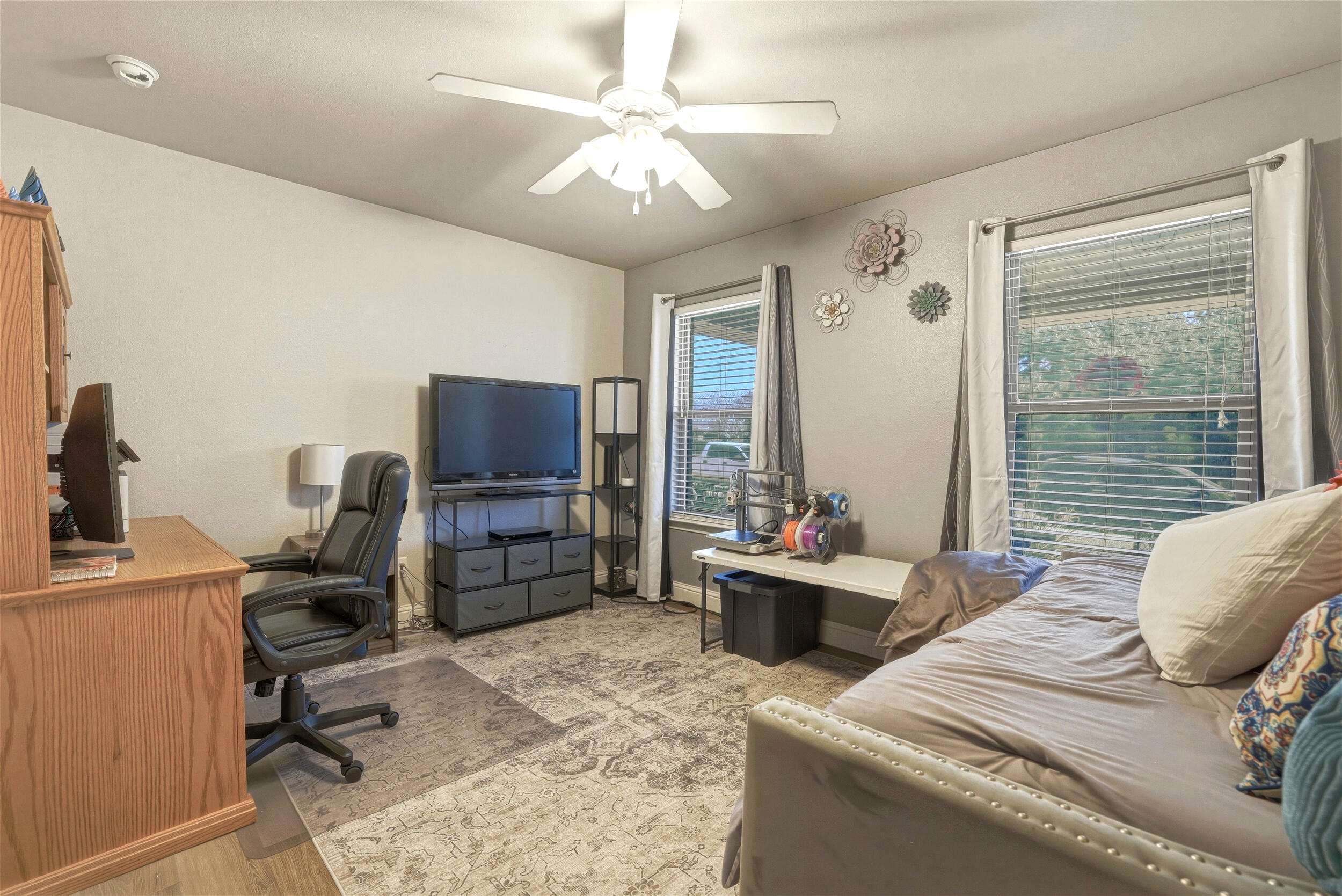 8808 Rochester Avenue Lubbock, TX 79424 - Photo 16 of 27 a bedroom with furniture and a window