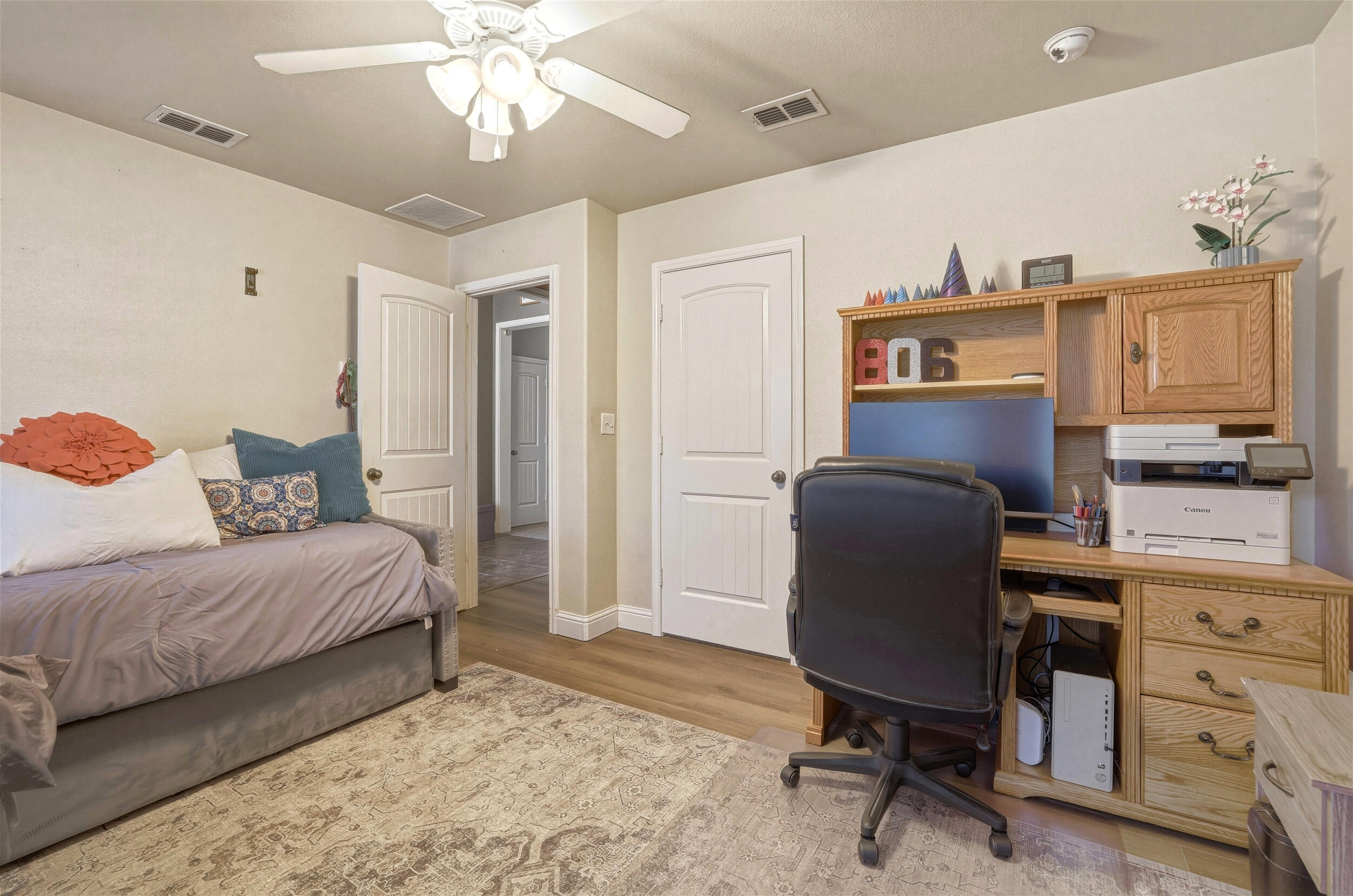 8808 Rochester Avenue Lubbock, TX 79424 - Photo 17 of 27 a bedroom with a workspace
