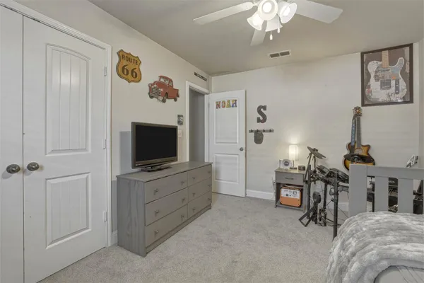 a bedroom with furniture and a window