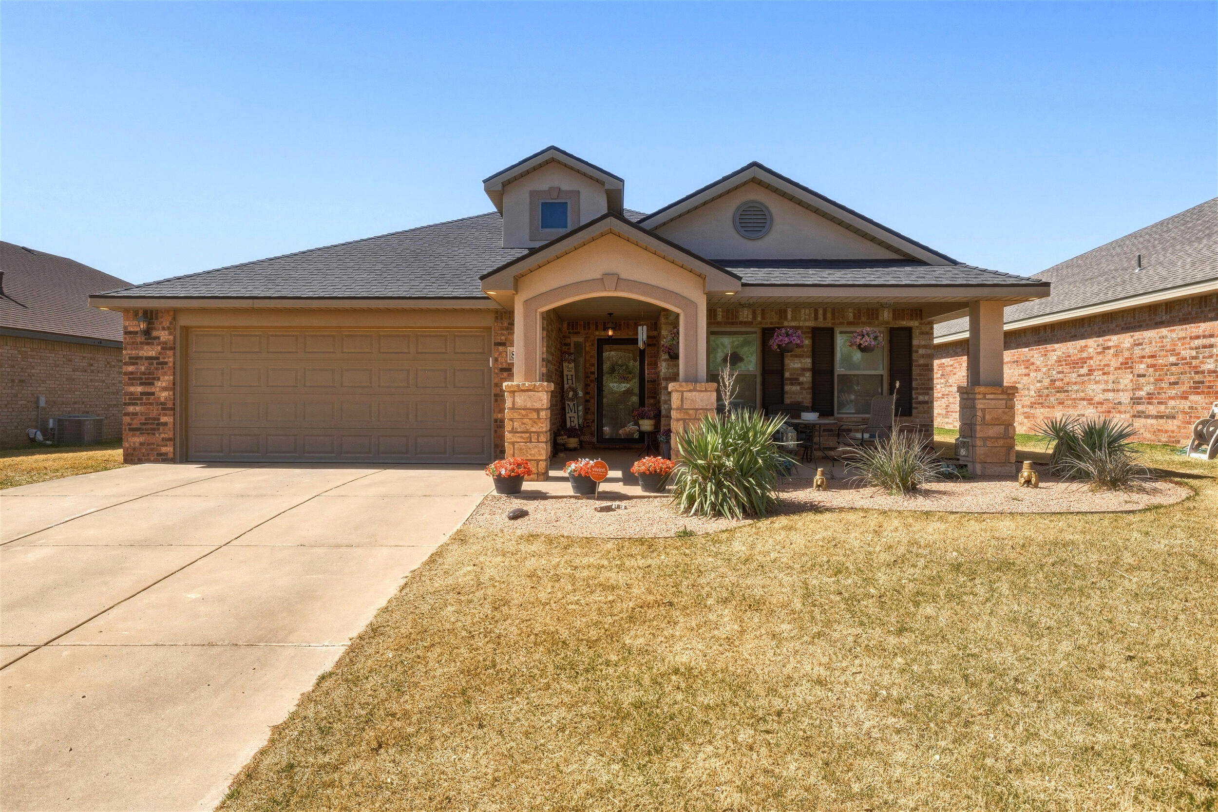 8808 Rochester Avenue Lubbock, TX 79424 - Photo 2 of 27 a front view of a house with garden
