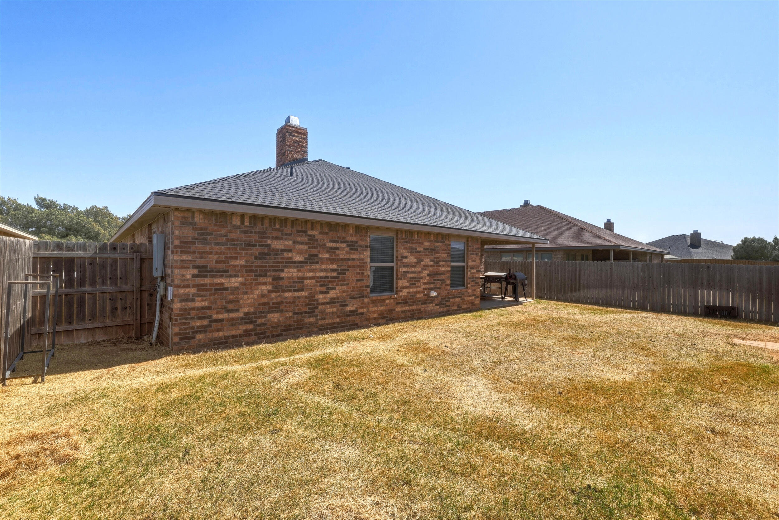 8808 Rochester Avenue Lubbock, TX 79424 - Photo 25 of 27 a front view of house with a yard