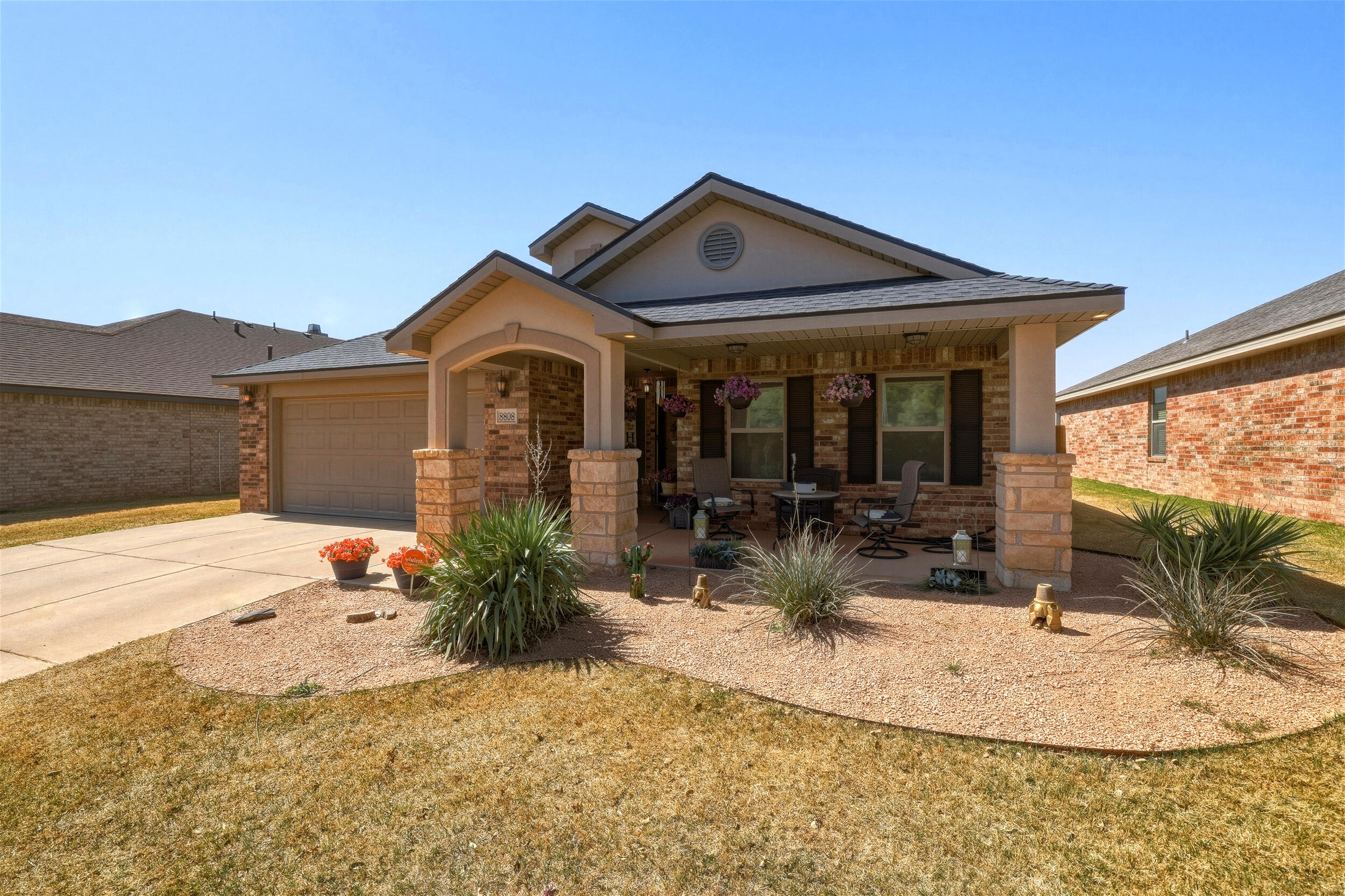 8808 Rochester Avenue Lubbock, TX 79424 - Photo 27 of 27 a front view of a house with a yard