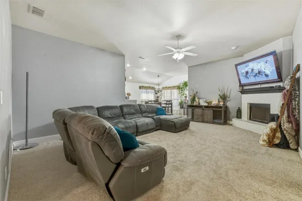 a view of a dining room with furniture and chandelier