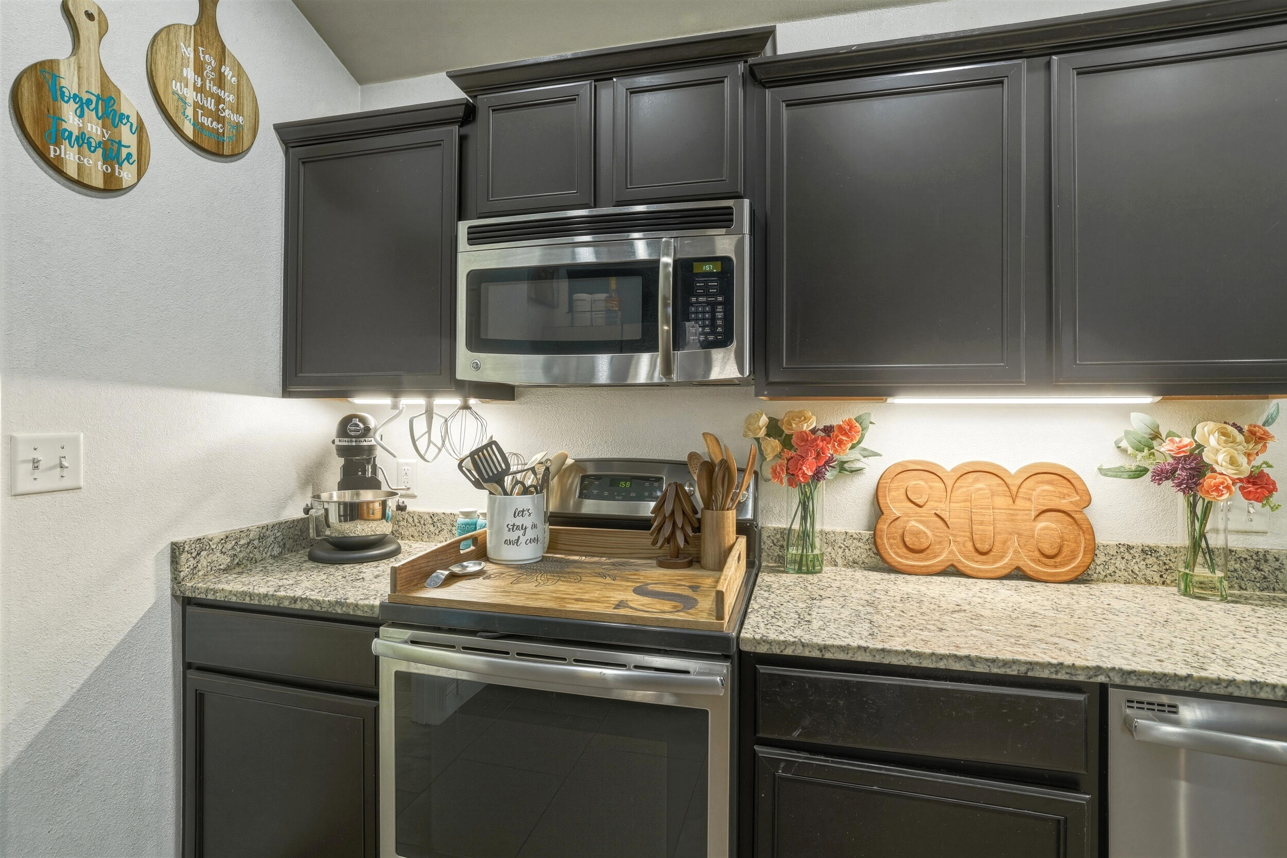 8808 Rochester Avenue Lubbock, TX 79424 - Photo 10 of 27 a kitchen with a sink and a microwave
