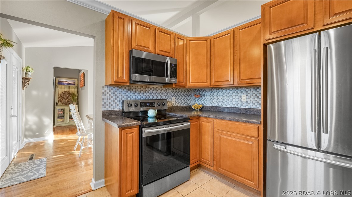 155 Lake Road Camdenton, MO 65020 - Photo 16 of 39 Partial view of kitchen looking into dining area