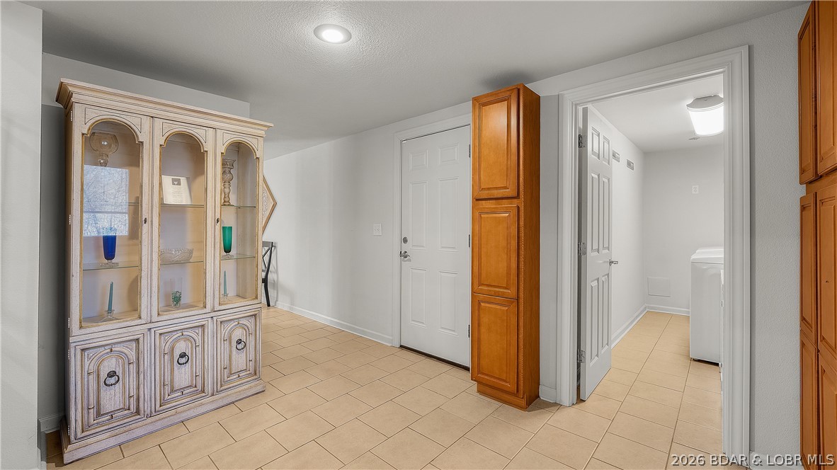 155 Lake Road Camdenton, MO 65020 - Photo 18 of 39 back entrance mud room with laundry room and garag