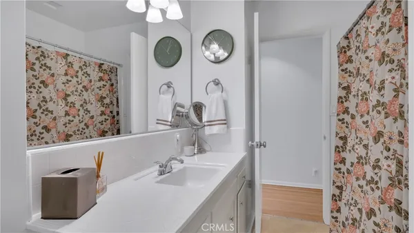 a bathroom with a glass shower door