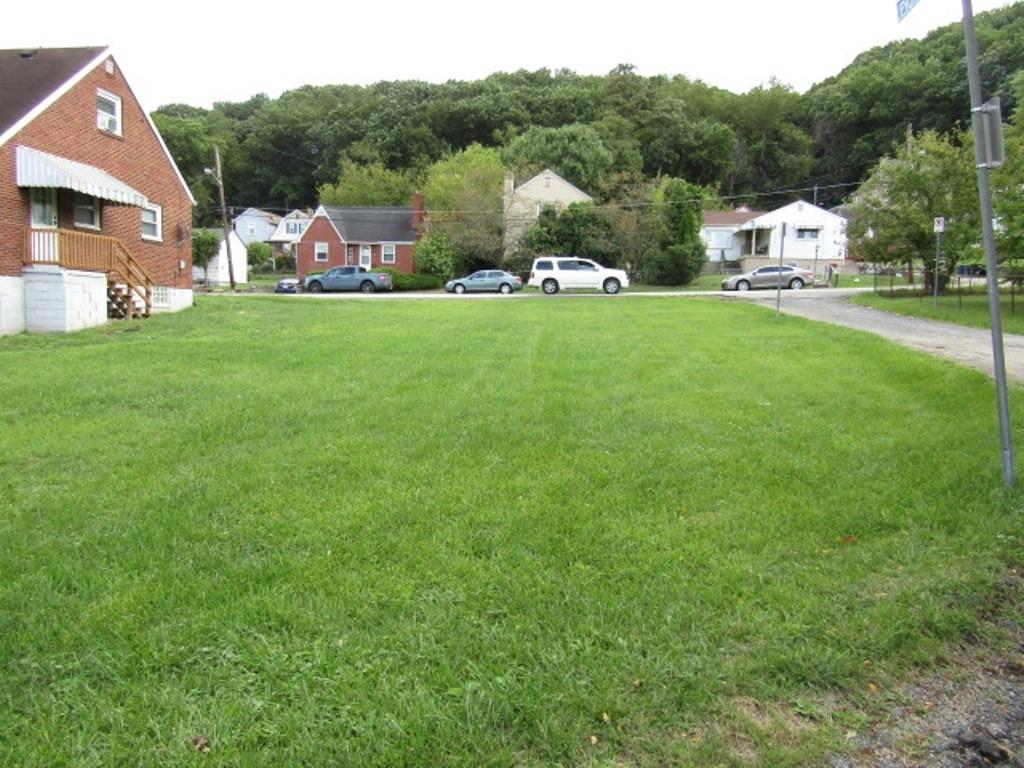 0 Hass Street Pittsburgh, PA 15204 - Photo 6 of 9 a view of a white house that has a big yard and large trees