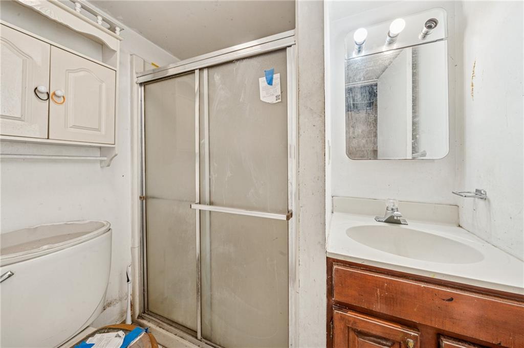 1160 Delaware Street Export, PA 15632 - Photo 11 of 27 a bathroom with a sink a toilet and shower