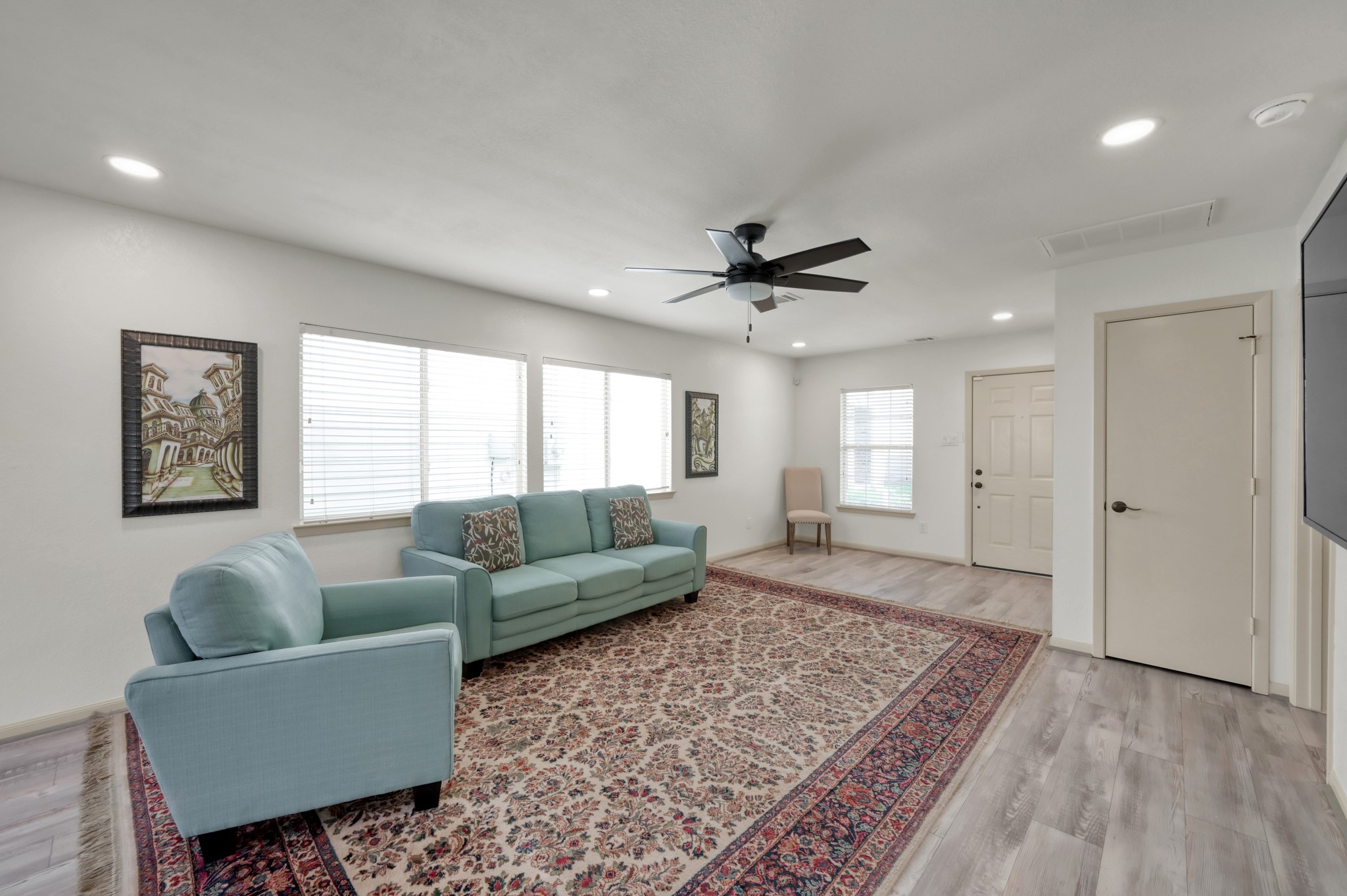 21815 Mossy Field Lane Spring, TX 77388 - Photo 5 of 39 Bright and spacious living area features recessed lighting, updated flooring, ceiling fan, and abundant natural light from oversized windows.