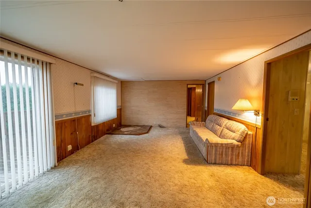 a spacious bedroom with a bed and a couch