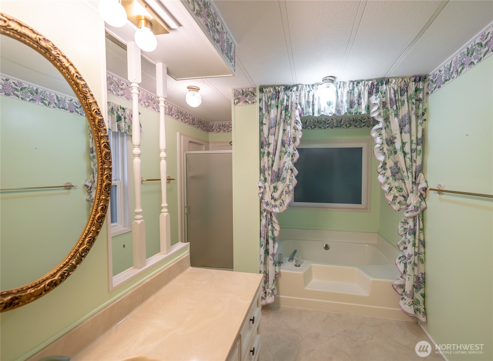 57 Clemons Road, Unit 64 Montesano, WA 98563 - Photo 18 of 35 a bathroom with a tub and shower