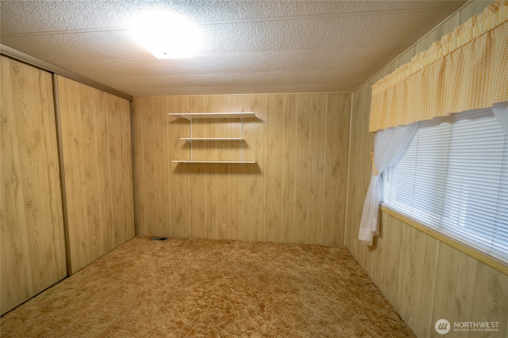 57 Clemons Road, Unit 64 Montesano, WA 98563 - Photo 22 of 35 a view of an empty room with a window