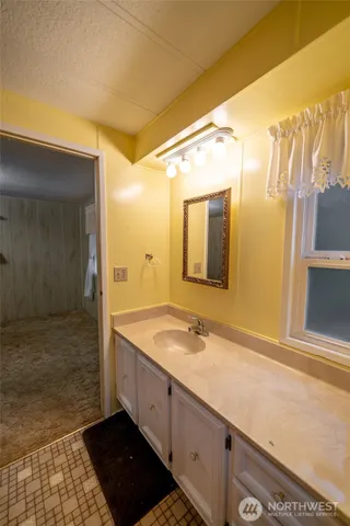 a bathroom with a sink and a mirror