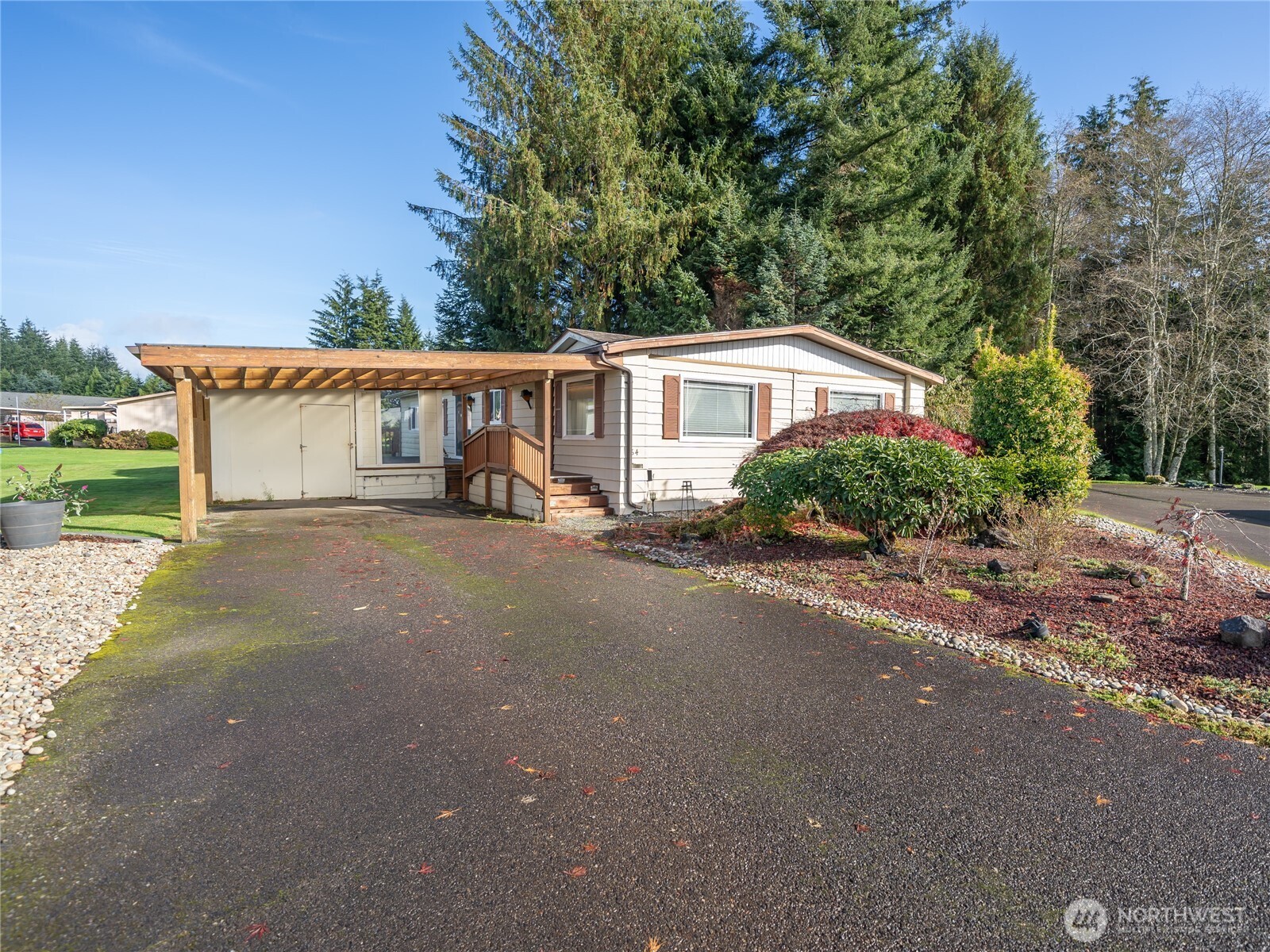 57 Clemons Road, Unit 64 Montesano, WA 98563 - Photo 27 of 35 a view of a house with a backyard