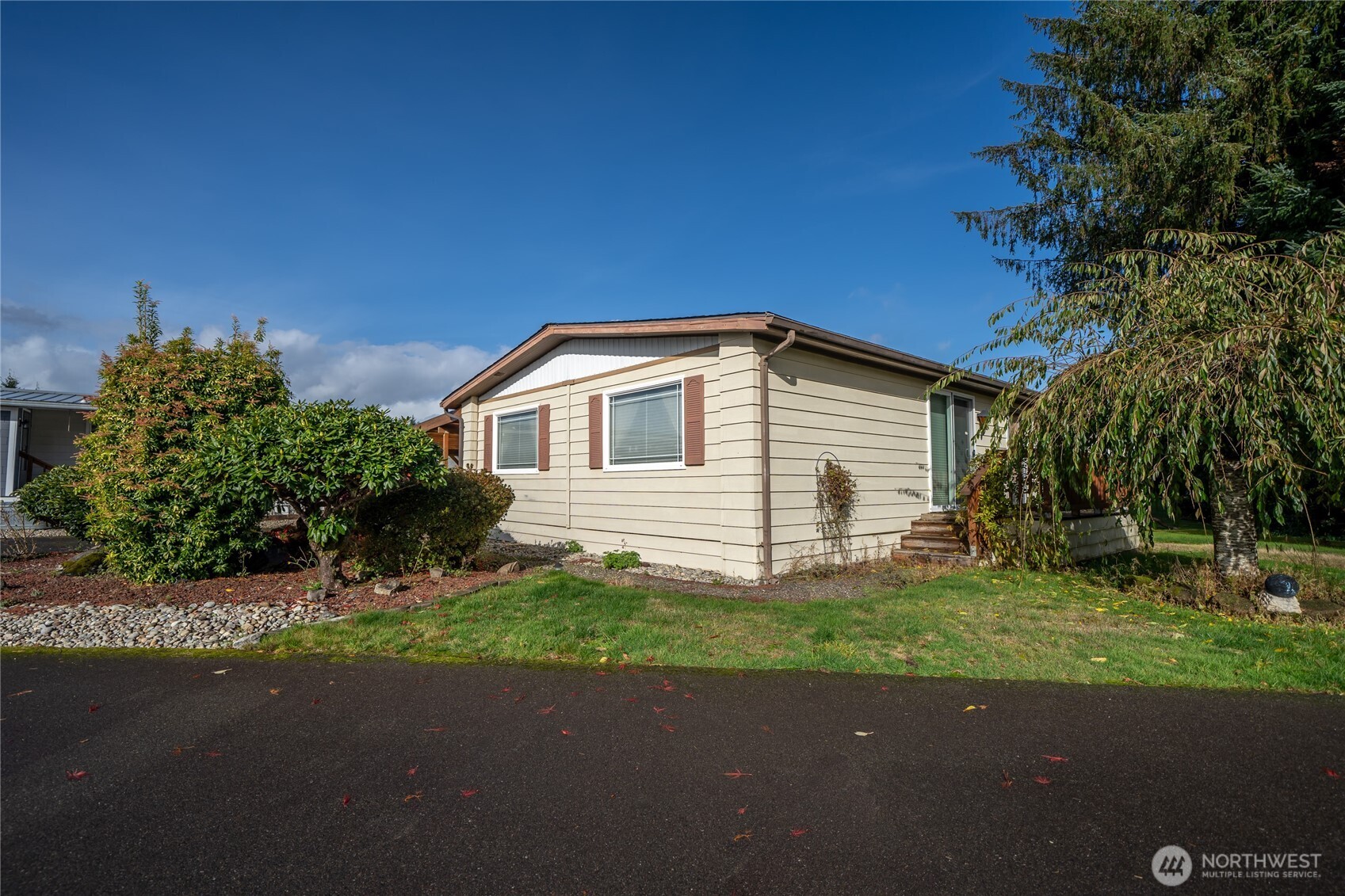 57 Clemons Road, Unit 64 Montesano, WA 98563 - Photo 32 of 35 a view of a house with a yard