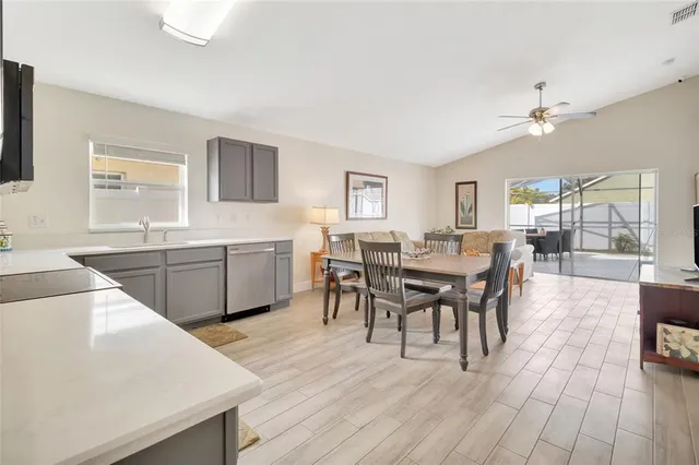 a view of a dining room with furniture and wooden floor