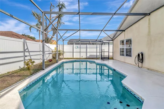 a view of a swimming pool with a patio