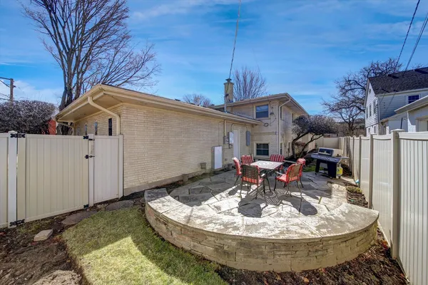 a view of a house with a fountain in a yard