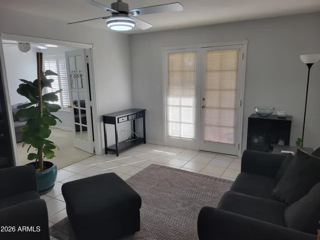 a living room with furniture and a window