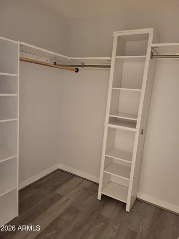 a view of an empty walk in closet