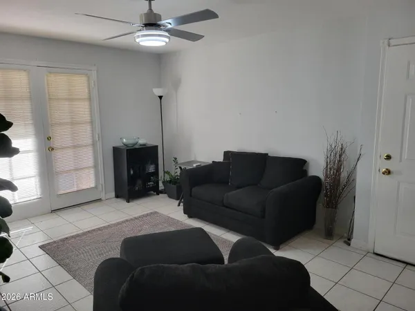 a living room with furniture and a fireplace