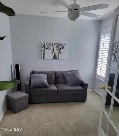 a living room with furniture and a window
